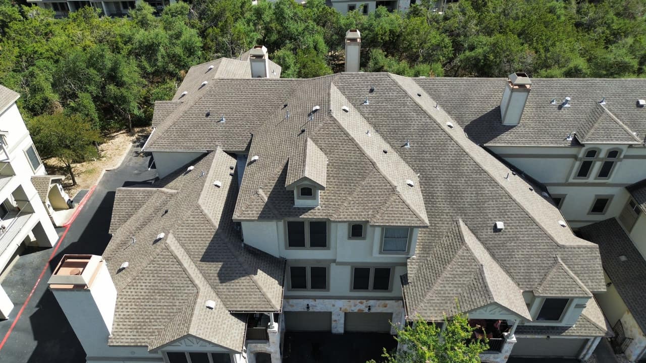 Texas home roof under a darkening sky as storm season approaches in Houston