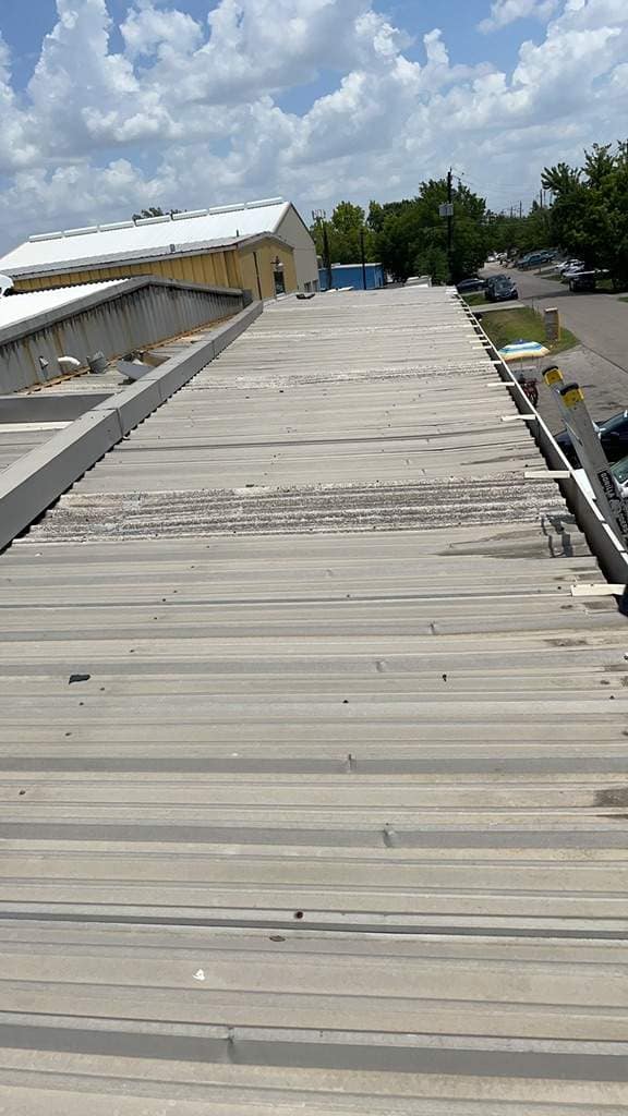 Texas residential roof with storm damage after a hurricane passes through the Houston area