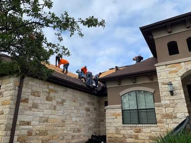 Elevation Roofing & Restoration crew installing a GAF shingle roof on a Texas home