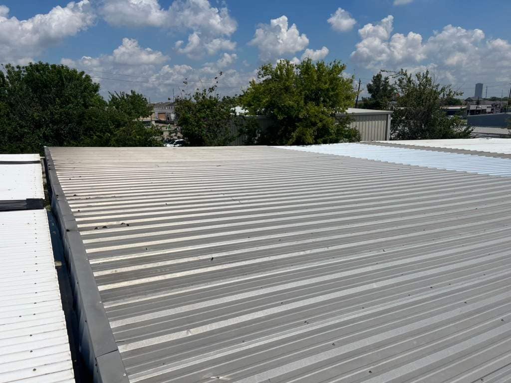 Dark storm clouds gathering over a Texas residential roof before hurricane season