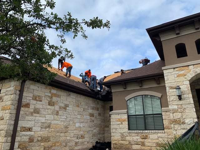 Elevation Roofing & Restoration crew installing a GAF shingle roof on a Texas home
